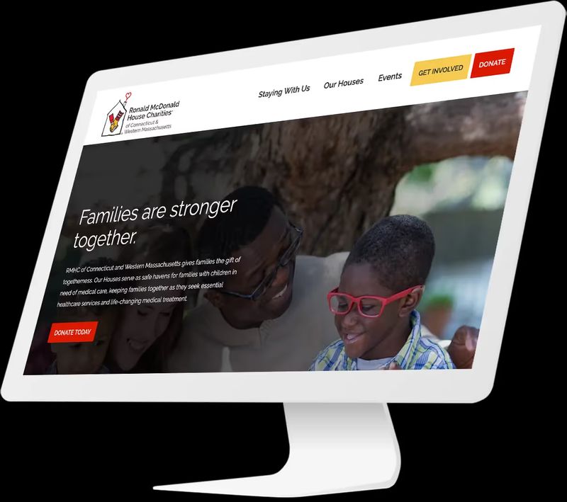 rendering of a desktop computer showing the redesigned website homepage of Ronald McDonald House Charities